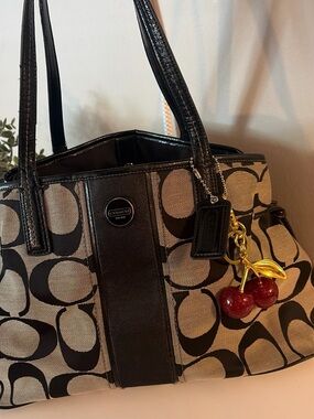 Coach Black and Tan Signature Tote with Cherry Charm